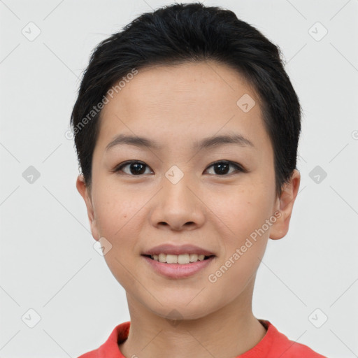 Joyful asian young-adult female with short  black hair and brown eyes