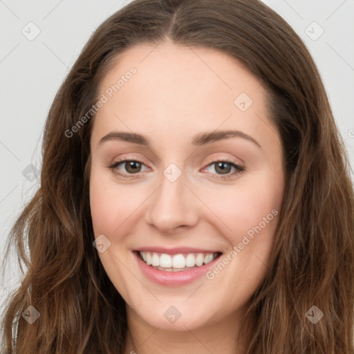 Joyful white young-adult female with long  brown hair and green eyes