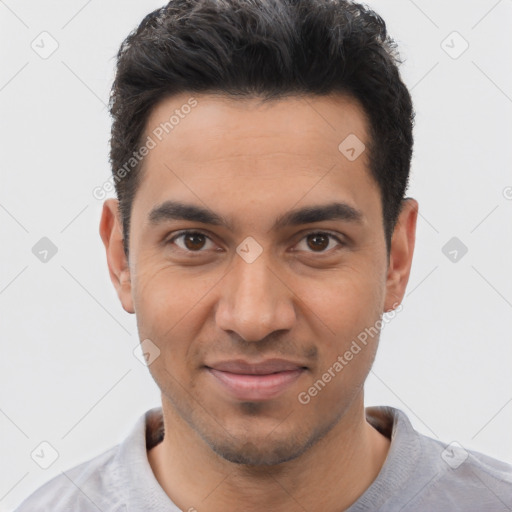 Joyful white young-adult male with short  black hair and brown eyes