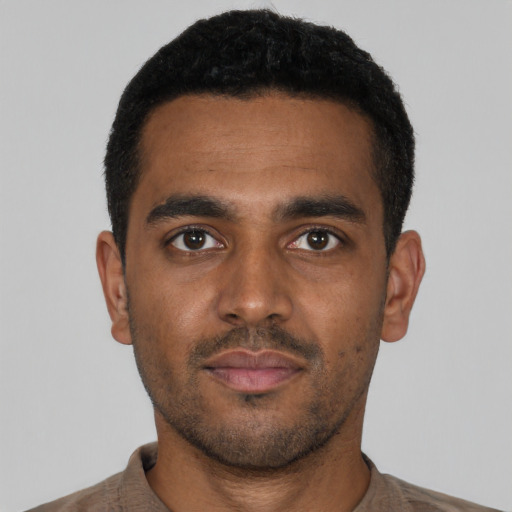 Neutral black young-adult male with short  black hair and brown eyes