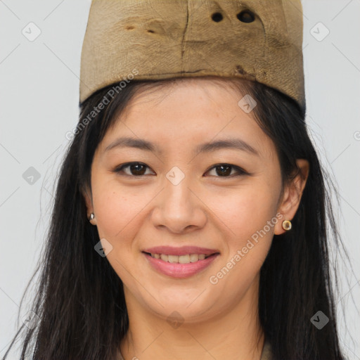 Joyful asian young-adult female with long  brown hair and brown eyes