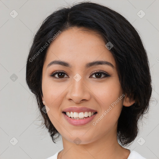 Joyful latino young-adult female with long  black hair and brown eyes