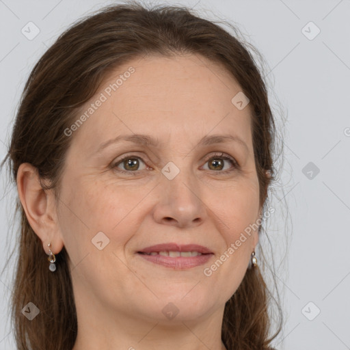 Joyful white adult female with long  brown hair and grey eyes