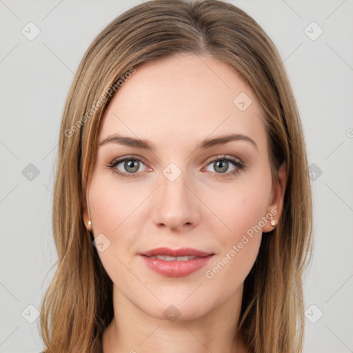 Joyful white young-adult female with long  brown hair and green eyes