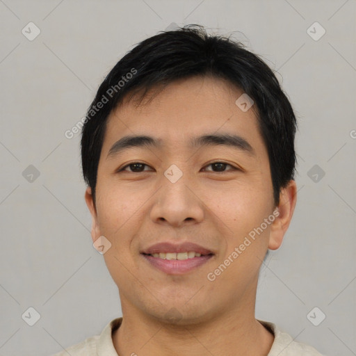 Joyful asian young-adult male with short  black hair and brown eyes