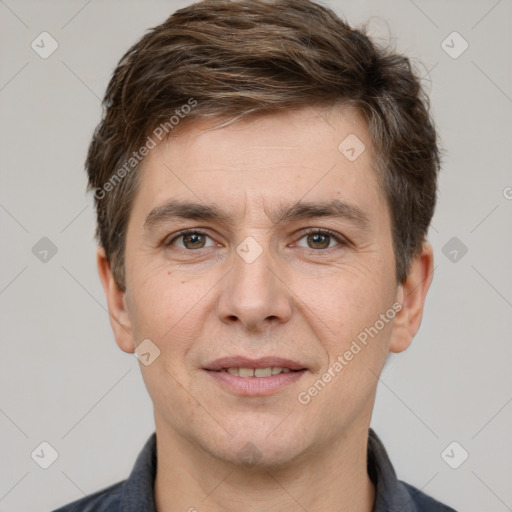 Joyful white adult male with short  brown hair and grey eyes