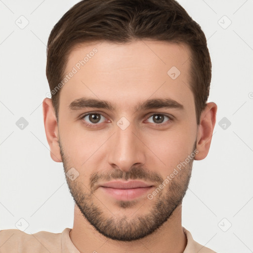 Joyful white young-adult male with short  brown hair and brown eyes