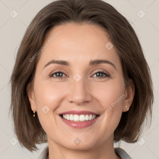 Joyful white young-adult female with medium  brown hair and grey eyes