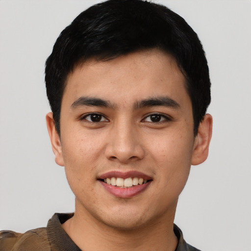 Joyful asian young-adult male with short  black hair and brown eyes