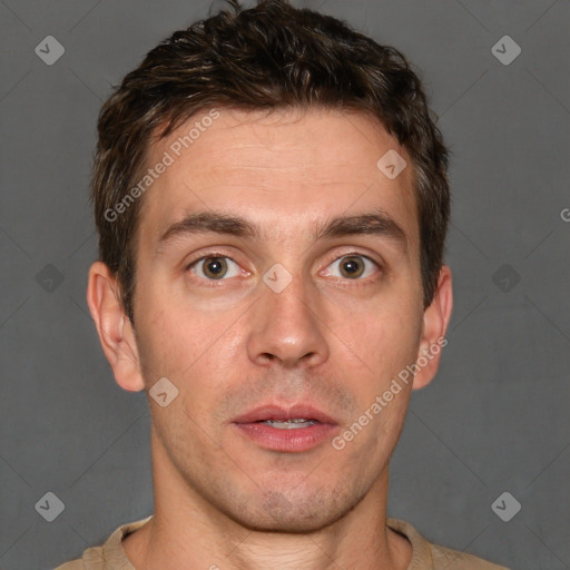 Joyful white young-adult male with short  brown hair and grey eyes