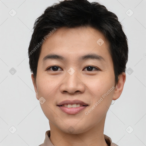 Joyful asian young-adult male with short  brown hair and brown eyes