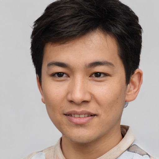 Joyful asian young-adult male with short  brown hair and brown eyes