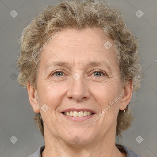 Joyful white middle-aged female with short  brown hair and brown eyes