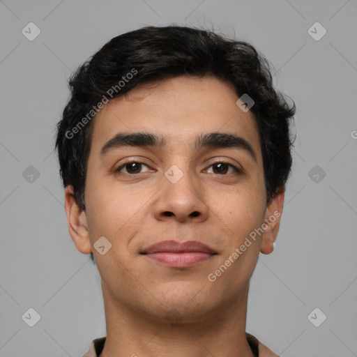 Joyful latino young-adult male with short  brown hair and brown eyes