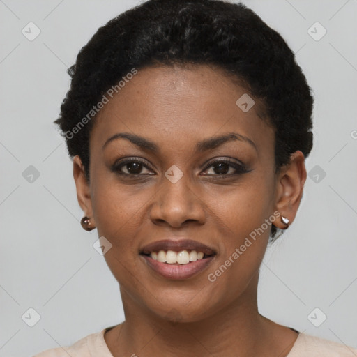 Joyful black young-adult female with short  black hair and brown eyes