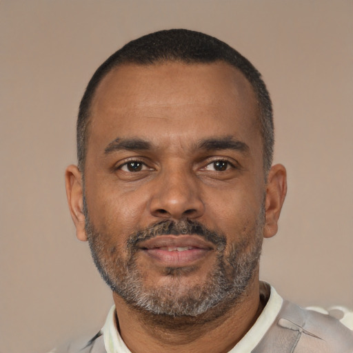 Neutral latino adult male with short  brown hair and brown eyes
