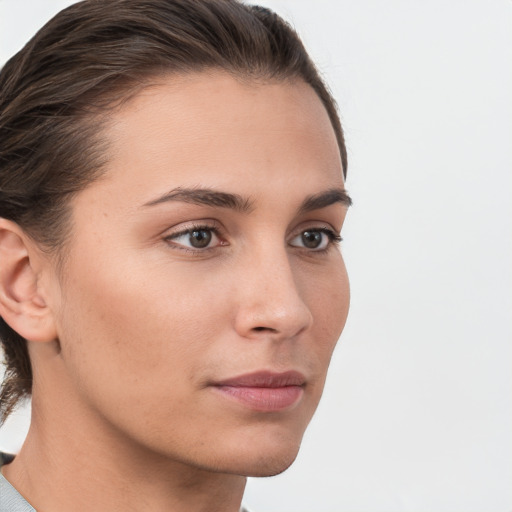 Neutral white young-adult female with short  brown hair and brown eyes