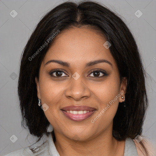 Joyful black young-adult female with medium  brown hair and brown eyes