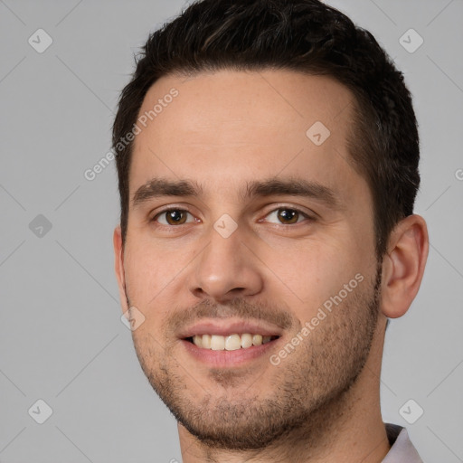 Joyful white young-adult male with short  brown hair and brown eyes