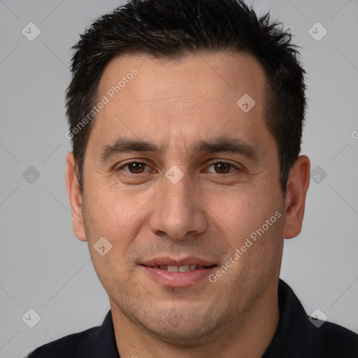 Joyful white adult male with short  brown hair and brown eyes