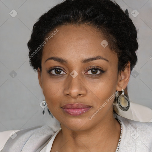 Joyful black young-adult female with short  black hair and brown eyes