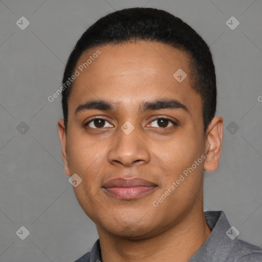 Joyful latino young-adult male with short  black hair and brown eyes