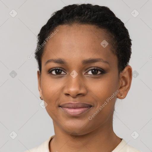 Joyful black young-adult female with short  brown hair and brown eyes