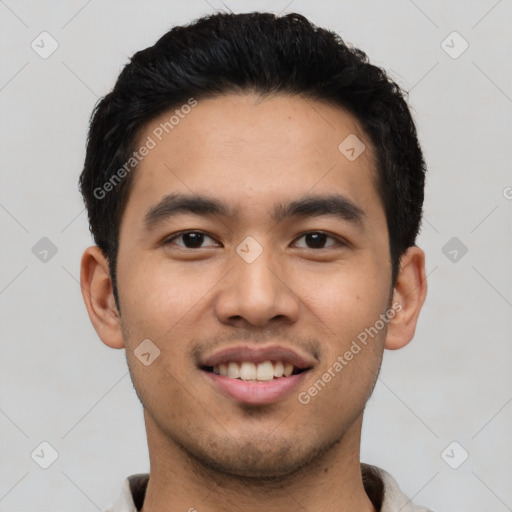 Joyful asian young-adult male with short  black hair and brown eyes