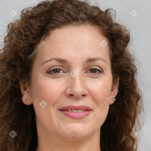 Joyful white adult female with long  brown hair and brown eyes