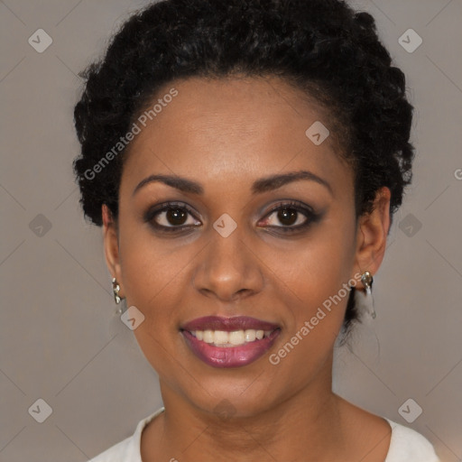 Joyful black young-adult female with short  black hair and brown eyes