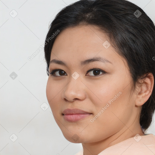 Joyful latino young-adult female with medium  brown hair and brown eyes