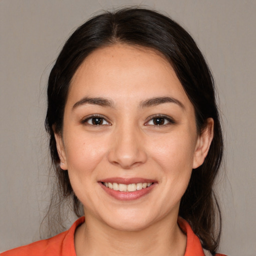 Joyful white young-adult female with medium  brown hair and brown eyes