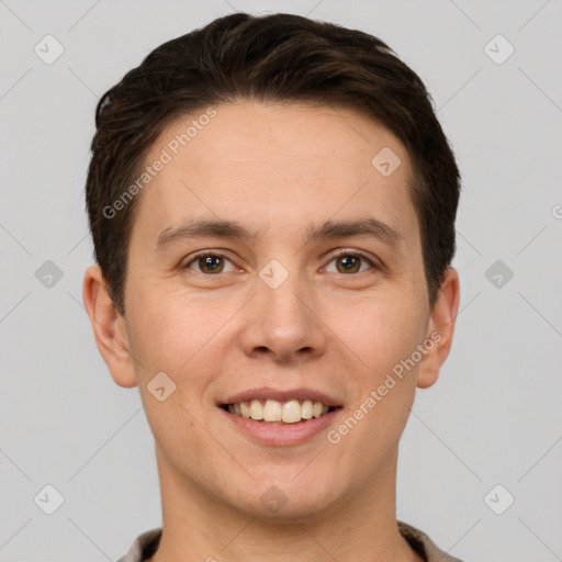 Joyful white young-adult male with short  brown hair and grey eyes