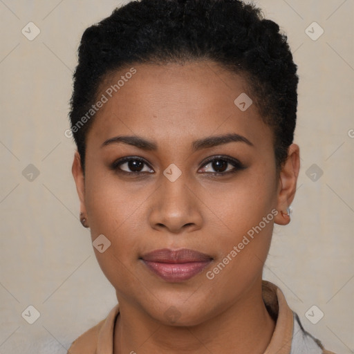 Joyful black young-adult female with short  brown hair and brown eyes