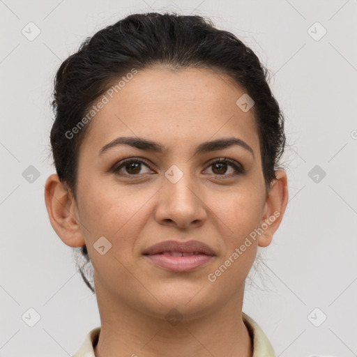 Joyful latino young-adult female with short  brown hair and brown eyes