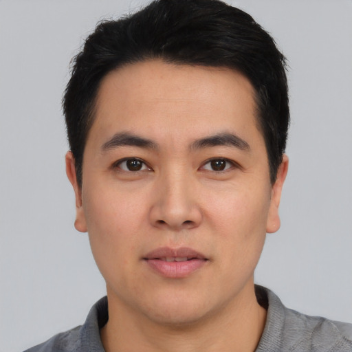 Neutral asian young-adult male with short  black hair and brown eyes