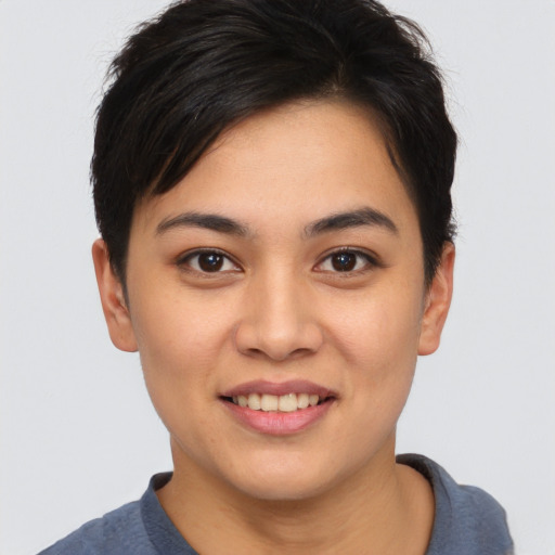 Joyful asian young-adult female with short  brown hair and brown eyes
