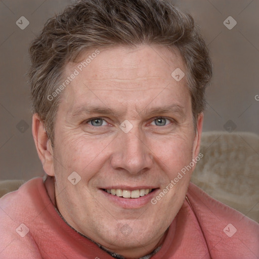 Joyful white adult male with short  brown hair and grey eyes