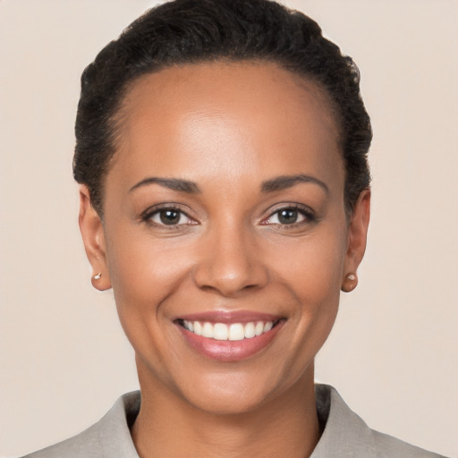 Joyful white young-adult female with short  brown hair and brown eyes