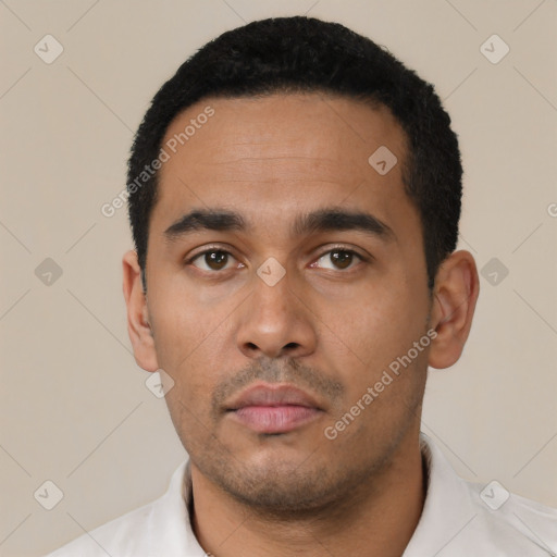 Neutral latino young-adult male with short  black hair and brown eyes