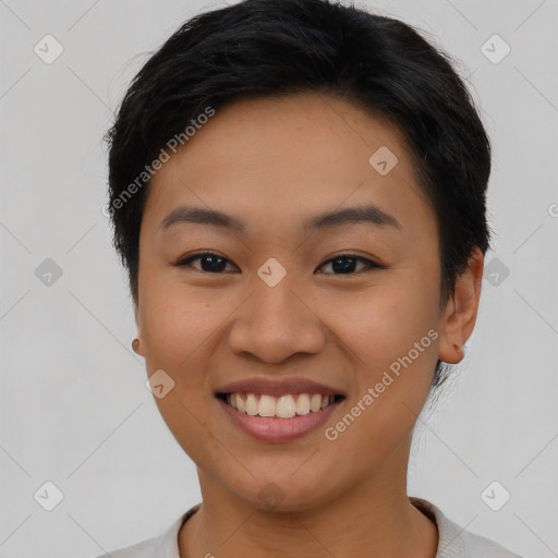 Joyful asian young-adult female with short  brown hair and brown eyes