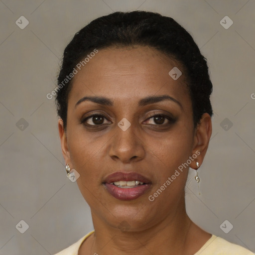 Joyful black adult female with short  brown hair and brown eyes