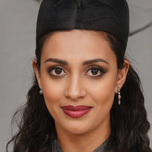 Joyful latino young-adult female with long  black hair and brown eyes