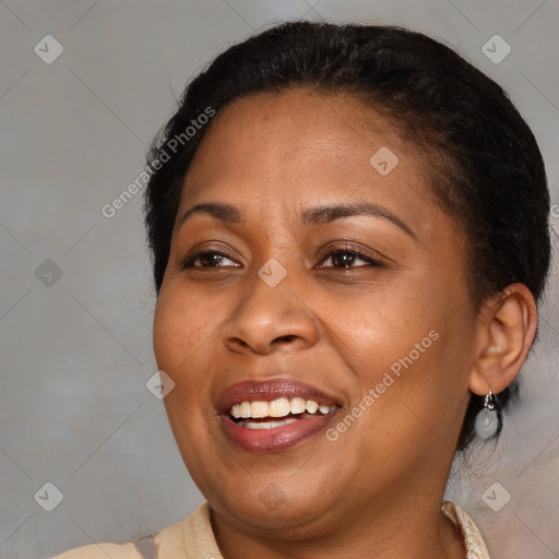 Joyful black young-adult female with medium  brown hair and brown eyes