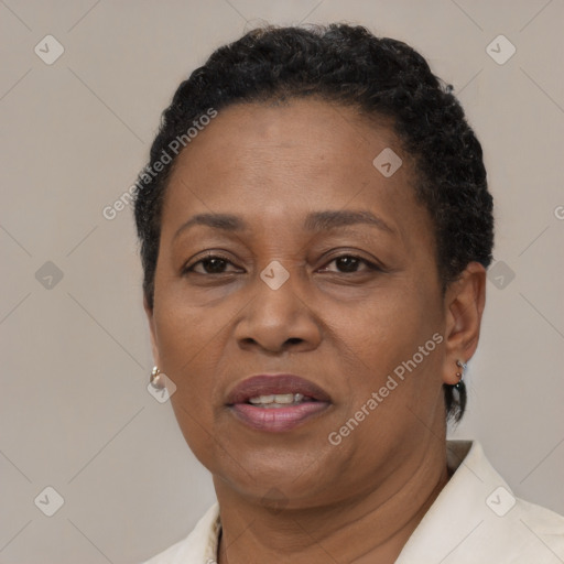 Joyful black adult female with short  brown hair and brown eyes