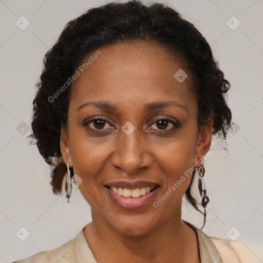 Joyful black adult female with short  brown hair and brown eyes