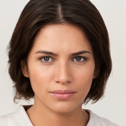 Neutral white young-adult female with medium  brown hair and brown eyes