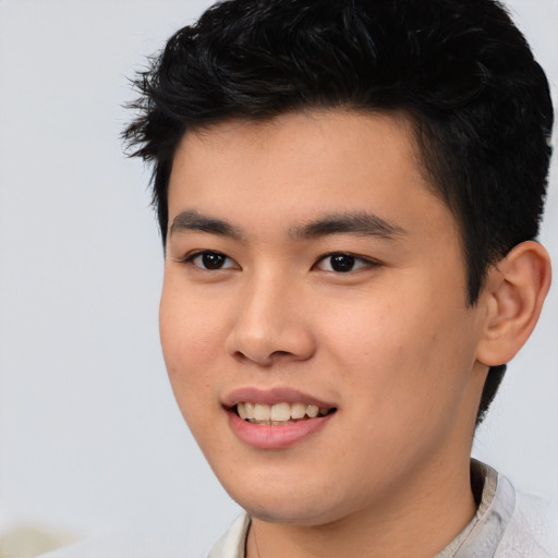 Joyful asian young-adult male with short  black hair and brown eyes