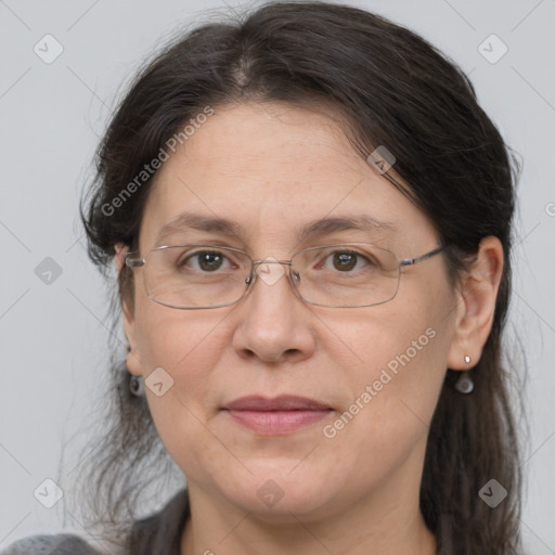 Joyful white adult female with medium  brown hair and grey eyes