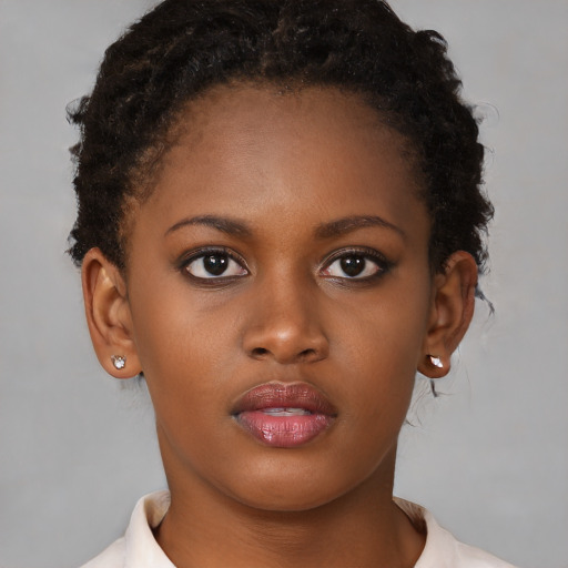 Neutral black young-adult female with short  brown hair and brown eyes